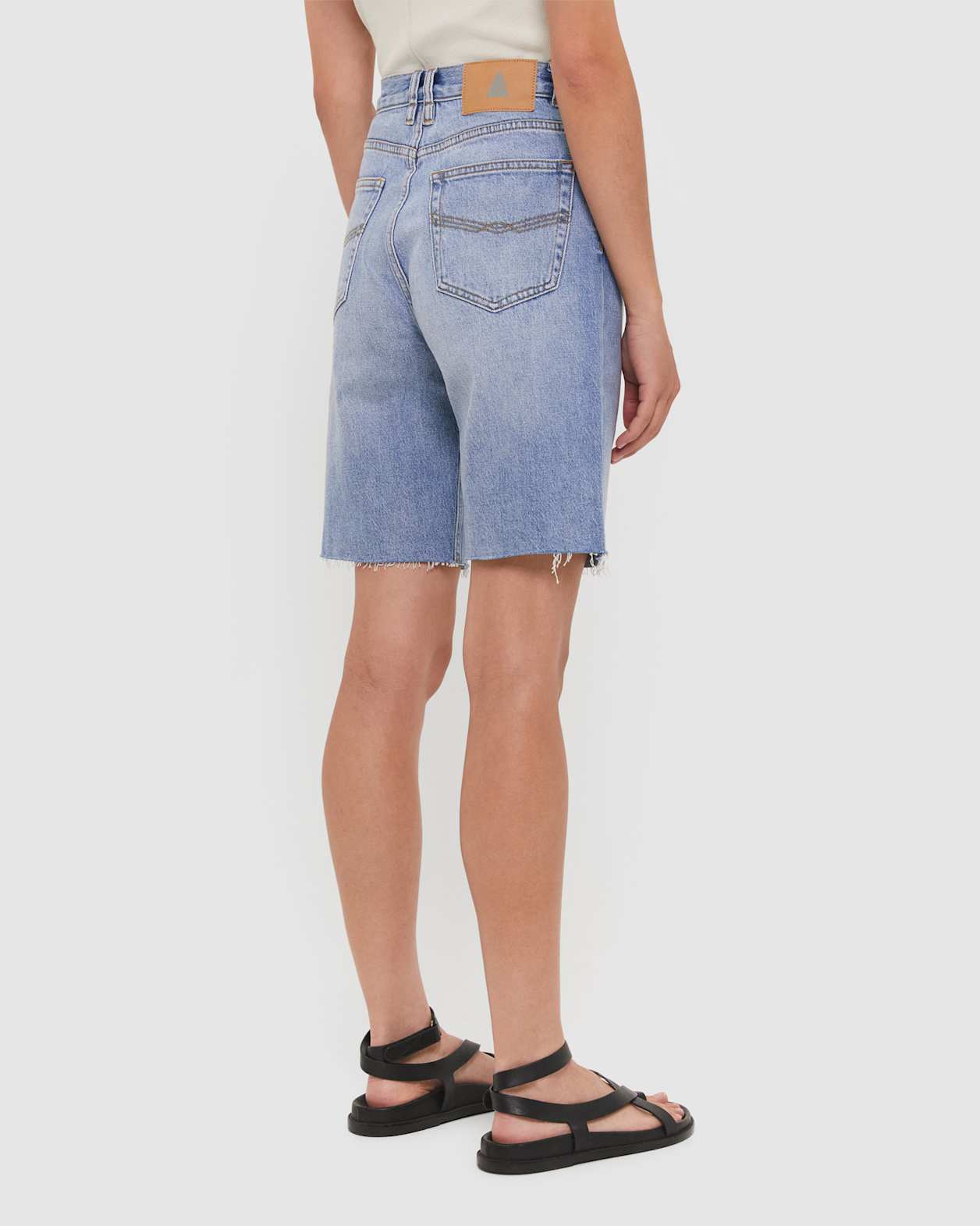 Tyla Denim Longline Short in BANDIT WASH