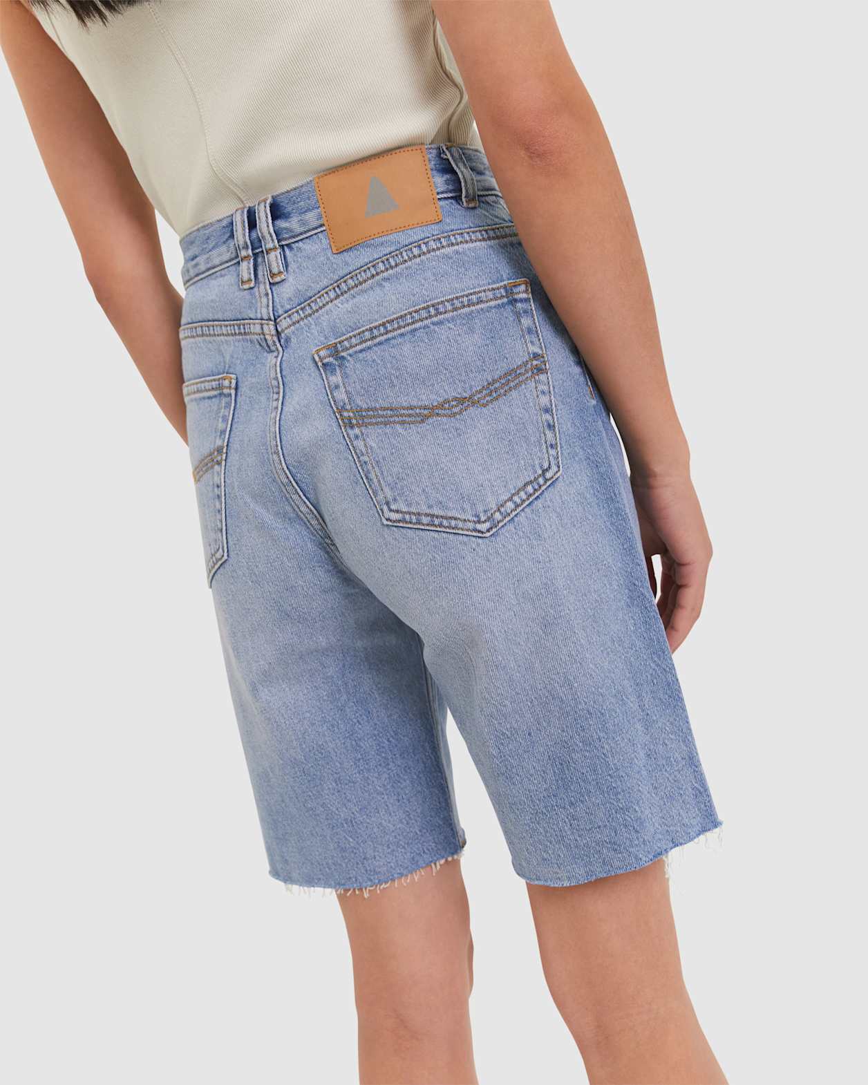 Tyla Denim Longline Short in BANDIT WASH